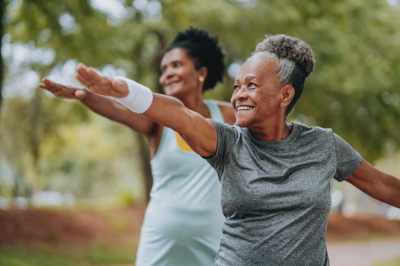 two women doing yoga