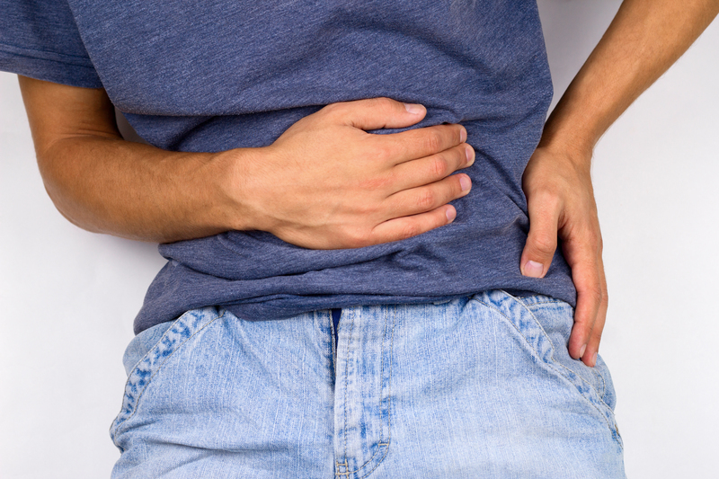 Person holding side caused by hernia pain