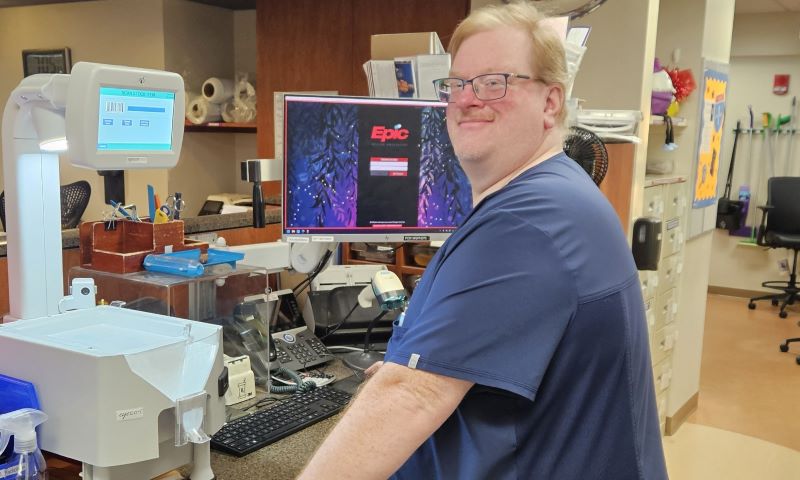 Christopher standing in pharmacy