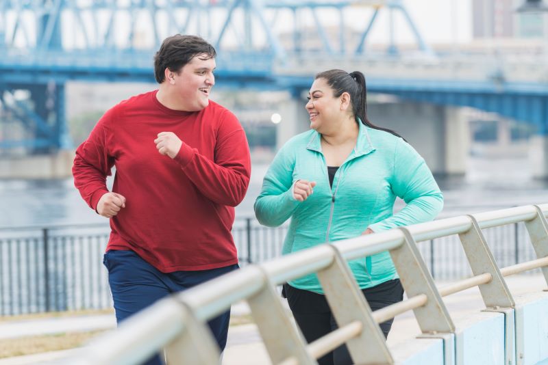 People exercising outside together. 