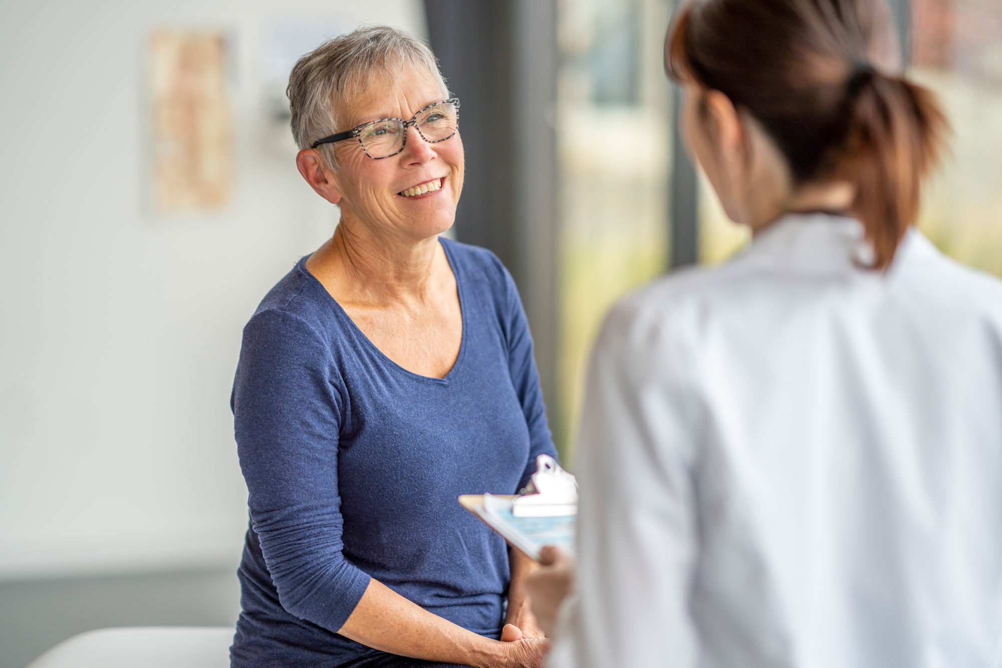 female patient talking to provider