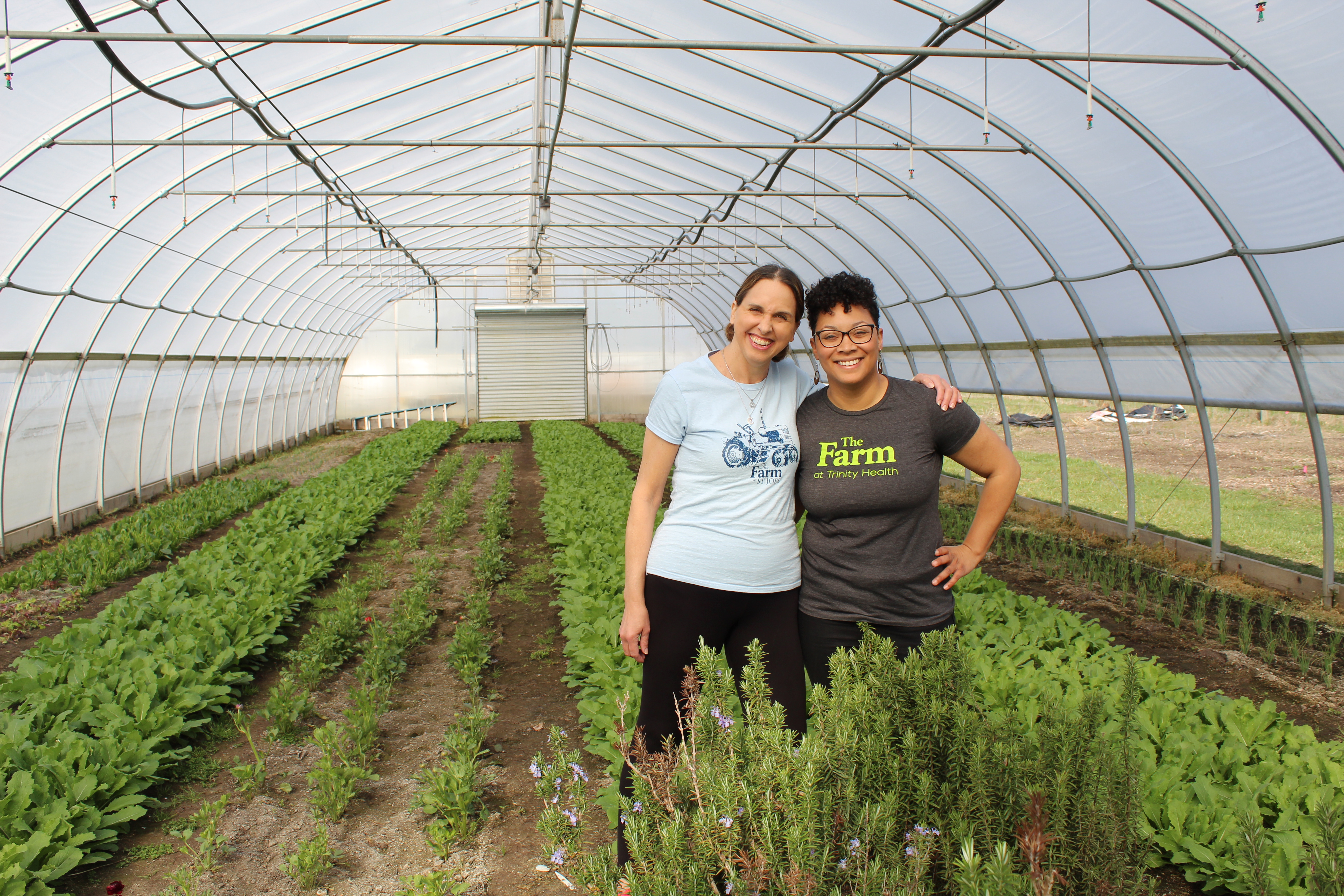 Vanessa and Alison standing in an indoor garden